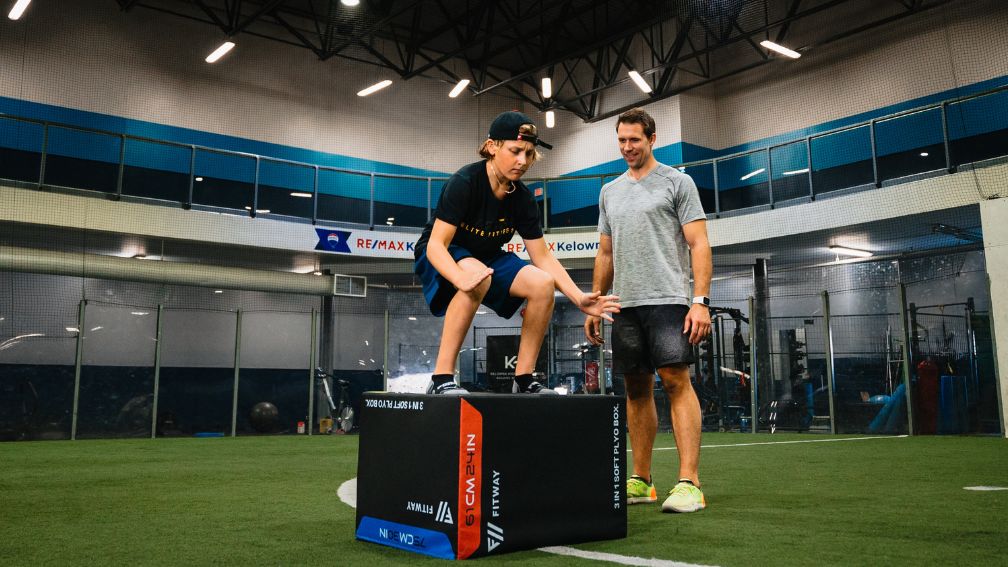 Hockey player performing a box jump